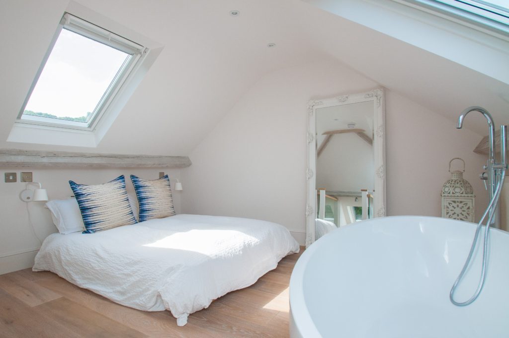 Modern Loft conversion, bedroom with modern white finish