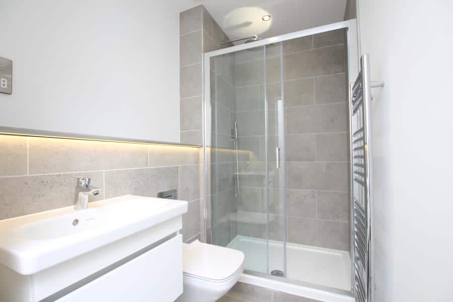 Modern bathroom designs, standing shower, toilet shown