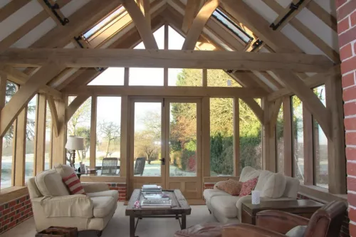 Oak Framed Home Extension in Wiltshire to Listed Farm House by WBC